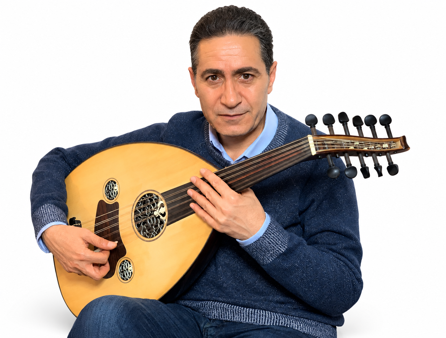 Hamam Khairy seated with his oud against a clean white background